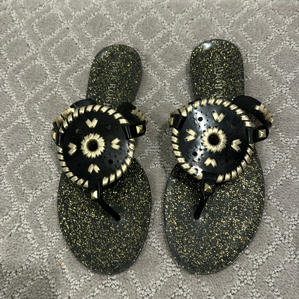 Jack rogers black and gold flip flops